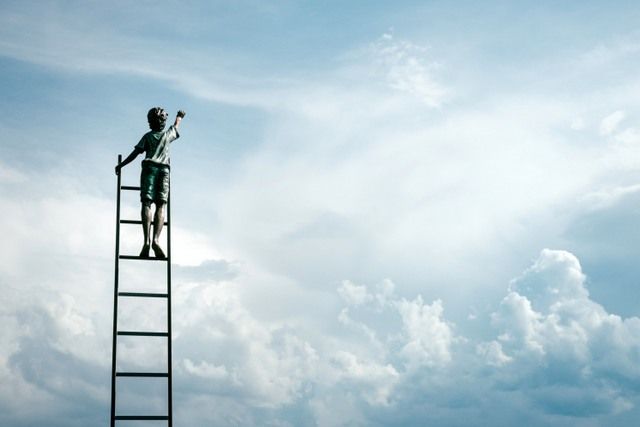 A Boy Painting The Sky Showing That We Should Never Stop Moving